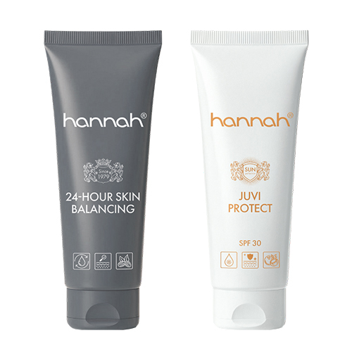 Twee tubes van hannah naast elkaar: de grijze 24-hour skin balancing en de witte juvi protect zonnebrandcrème met spf 30.