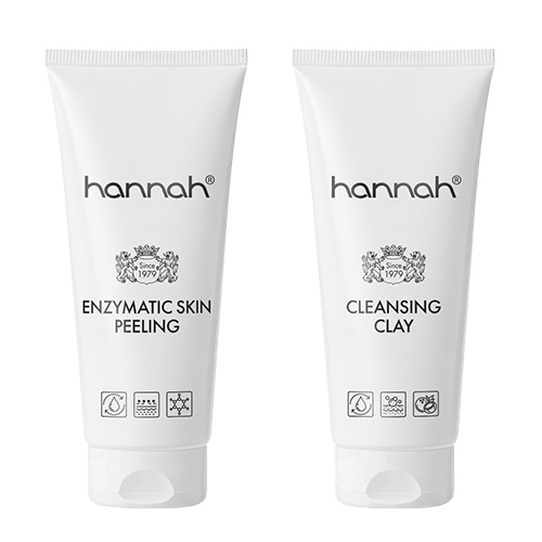 Twee witte tubes van hannah naast elkaar: de Enzymatic Skin Peeling voor milde exfoliatie en de Cleansing Clay voor een diepe reiniging van de poriën.